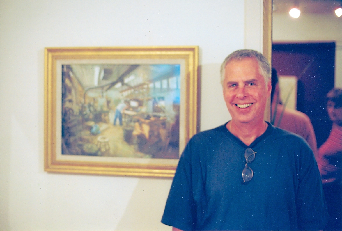 brahm friedlander beside painting of shop